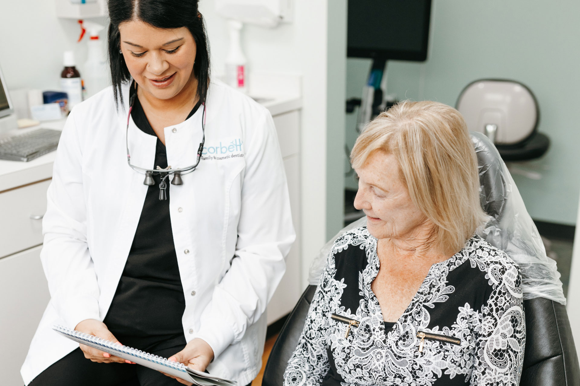 dental assistant talking to patient
