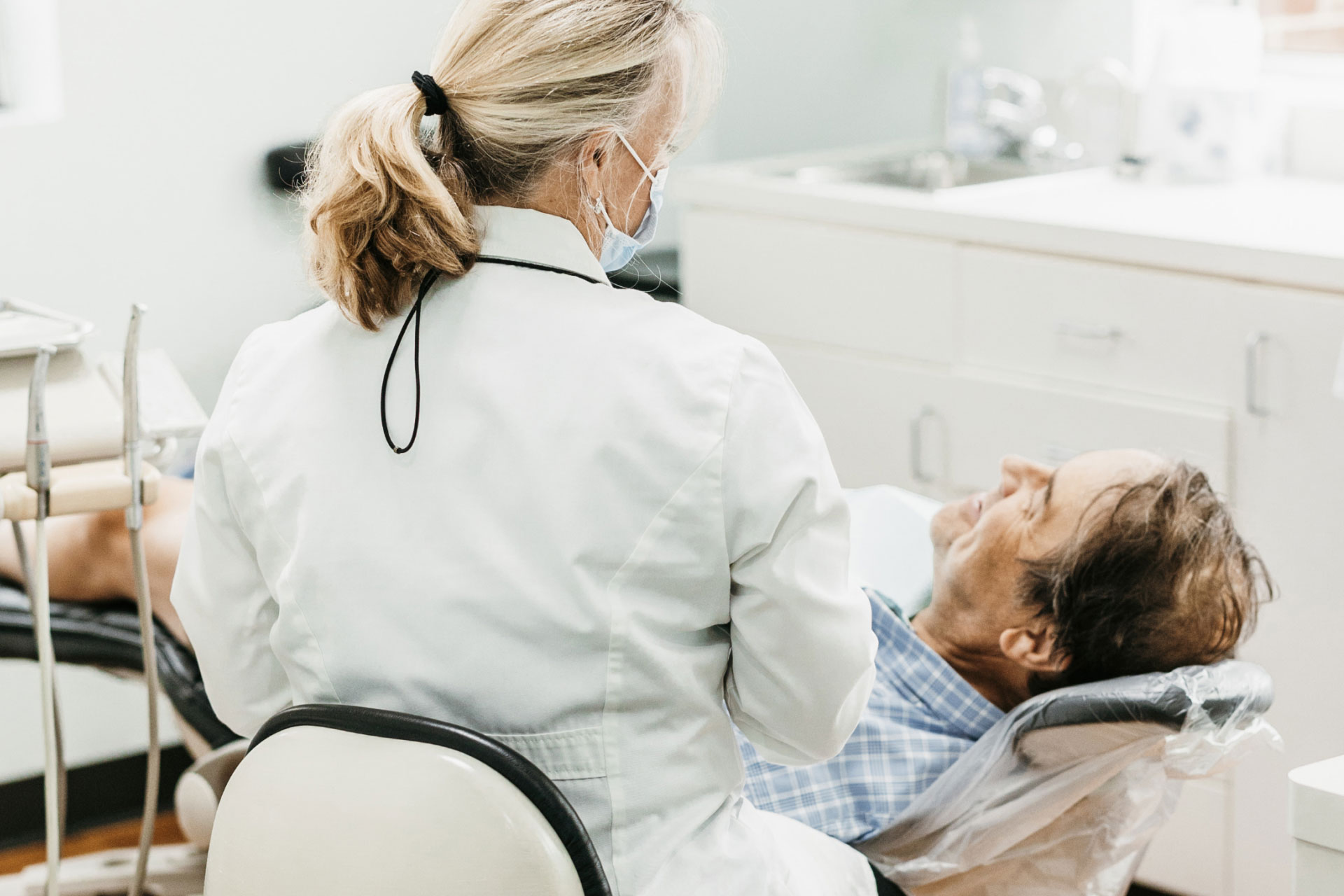 Dr. Corbett talking with male patient in exam room